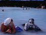 People enjoying silica mud treatment, Blue Lagoon geothermal complex.