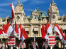 Monaco crest and flags flying in Place du Casino in front of Monte Carlo Casino.