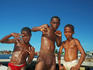 Boys playing on marina in front of Belize Bay.