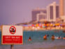 No swimming sign at beach.