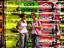 Young girls infront of billboard.
