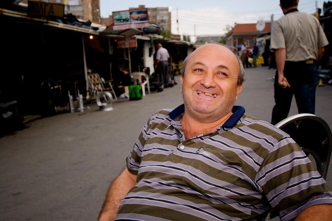 Laughing stall holder at market, Yerevan