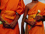 Orange-robed monks at Phra Pathom Chedi, the world's talles Buddhist monument.