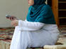 Islamic woman with mobile phone at Gazi Husrev Bey Mosque, Bascarsija.