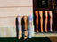 Stockings on mannequin legs outside shop.