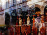 Shop window display and reflection of town hall.