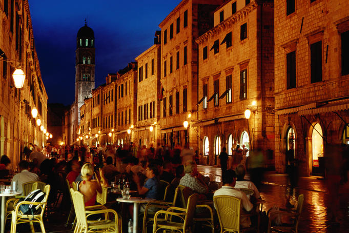 Outdoor cafe on Placa at dusk.