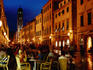 Outdoor cafe on Placa at dusk.