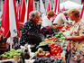 Trader and customer at morning market on Gunduliceva Poljana in old town.