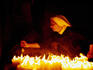 Nun attending candles at Stone Gate Shrine.