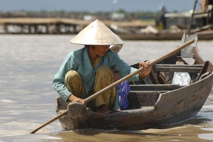 Resident navigates the floating village of Chong Kneas, northern end of Tonle Sap lake.