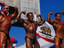 Male body builders posing at Muscle Beach, Venice.