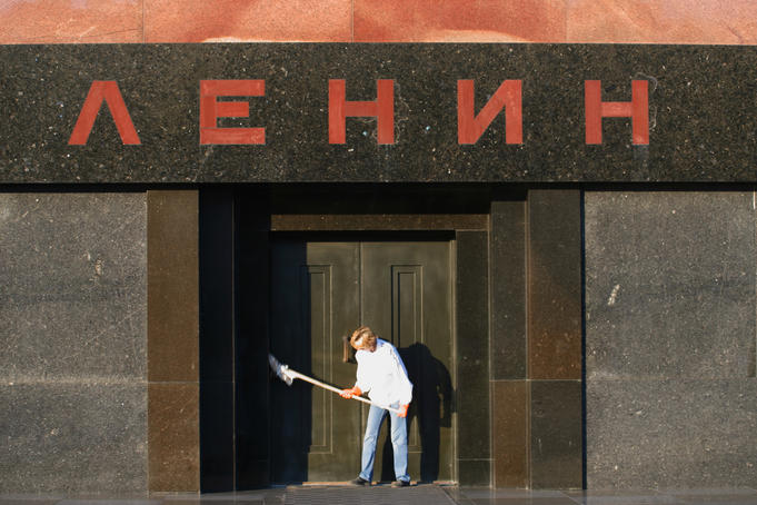 Person dusting down Lenin's Tomb, early morning.