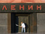 Person dusting down Lenin's Tomb, early morning.