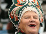 Portrait of singer in traditional costume at Vernisazh Market.