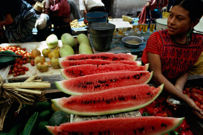 A Mayan girl working at a fruit stall.