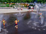 Kids playing in fountains at Coal Harbor.