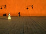 People walking outside walls of Koutoubia Mosque.