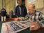 Man with sports newspaper.