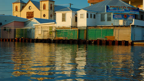 Haulover Creek with colourful riverside buildings in central Belize City.
