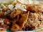 Rice with beans (National Dish in Belize) with fried fish fillets, salsa salad.
