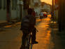 Cruising down Albert Street on push bike at sunset.