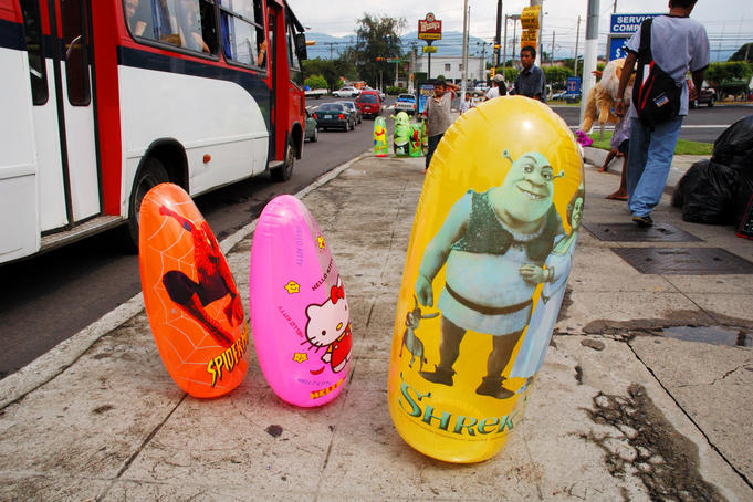 Inflatable punching bags for sale on Boulevard de los Heroes.