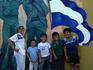Children in front of mural.