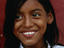 A young girl smiling