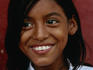 A young girl smiling