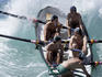 Men competing in surfboat carnival at Bilgola Beach.