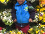 Boy amongst flowers on Avenue San Martin.