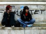Teenagers near graffiti at Trg Republike.