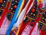 Traditional costumes for sale in tourist shop.