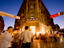 People shopping in Fountain Square area at dusk.