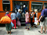 Shoppers boarding a tram at Ladies Market.