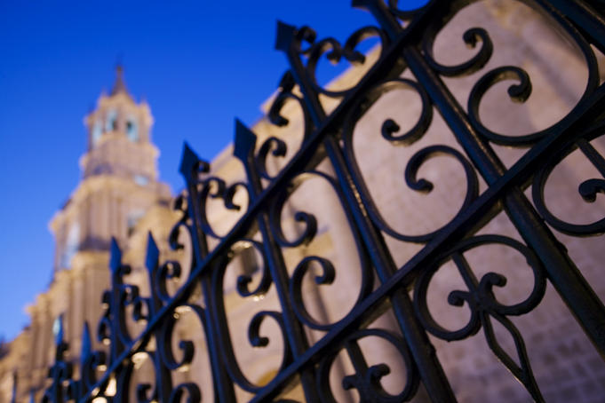 Iron railing and cathedral.