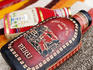 Leather and cloth flask covers.