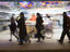 Pedestrians in motion out at night on Calle Condell, near Plaza Victoria.