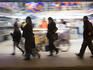 Pedestrians in motion out at night on Calle Condell, near Plaza Victoria.
