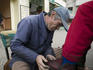 Shoeshine man at work in Plaza Anibal Pinto, Valparaiso