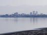Knik Arm of Cook Inlet, Anchorage skyline and Chugach Mountains.