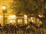 People sitting outdoors at Cafe Lisboa at night, Plaza Doctor Collado, La Seu and El Mercat.