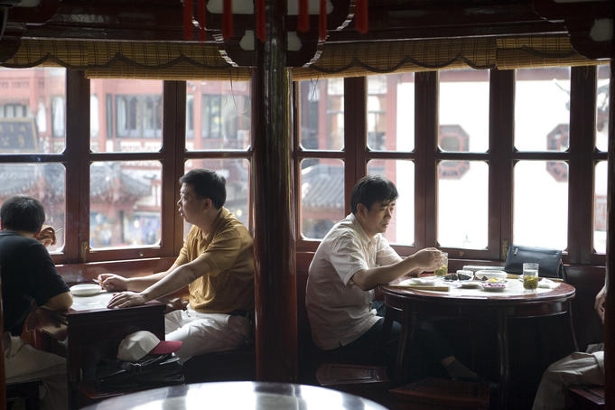 Drinking tea at Hu Xin Ting (Mid Lake Pavillion) Tea House (1784), Yu Yuan Bazaar, Old Shanghai.