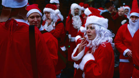 People dressed as Santa Claus in Central Park.