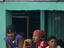 Passengers waiting for boat at terminal.