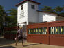 Man walking past Faith Baptist Church, Little Corn Island.