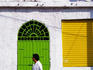 Man passing door in Old Town.