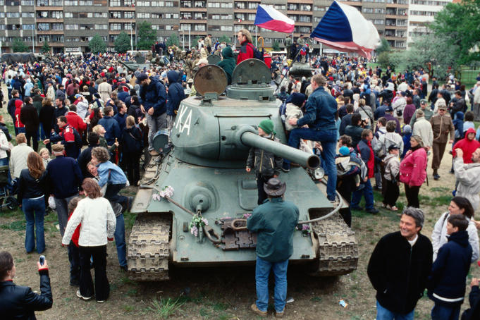 People around Russian T-34 tank during 50th anniversary of Liberation.