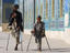 Father and son amputees outside the Shrine of Hazrat Ali.